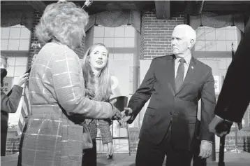  ?? CHARLES KRUPA/AP ?? Former Vice President Mike Pence meets with people Wednesday in Manchester, New Hampshire.