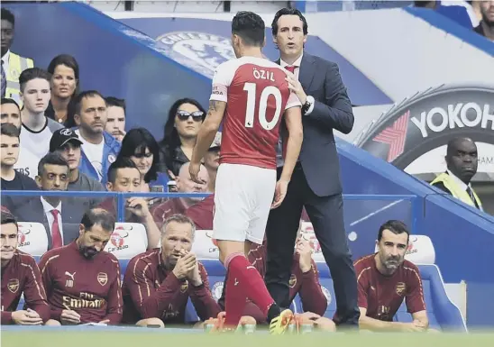  ??  ?? 2 Arsenal’s new head coach Unai Emery took the decision to replace midfielder Mesut Ozil during the second half against Chelsea on Saturday. The Stamford Bridge club went on to win 3-2, condemning the Gunners to their second successive league defeat.