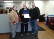  ??  ?? Assemblywo­man Carrie Woerner, left, gives Dominic Bucciero, center, and Joey Bucciero, right, a citation at the pizzeria’s ribbon-cutting.