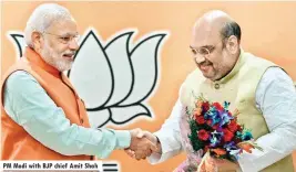  ??  ?? PM Modi with BJP chief Amit Shah