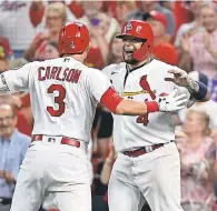  ?? JEFF CURRY/ USA TODAY SPORTS ?? Dylan Carlson celebrates a grand slam against the Cardinals with Yadier Molina.