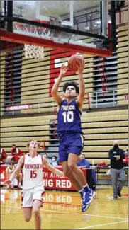  ?? PILOT PHOTO/RUDY MARQUEZ ?? Triton’s Ashton Oviedo scores two of his game-high 25 points on this layup while Nolan Bales looks on.