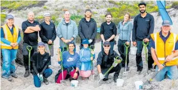  ?? Photo / Supplied ?? Coast Care stalwarts Chris and Jayne Ward are set to retire, pictured here in high-vis with the team.