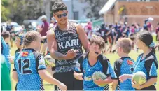  ?? Picture: GLENN HAMPSON ?? Latrell Mitchell is the king of the kids.