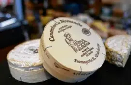  ?? CHRISTOPHE ENA/ASSOCIATED PRESS/FILE ?? Camembert on sale at a Paris shop in November. A study by the French National Center for Scientific Research said that Camembert and brie are on “the verge of extinction.”