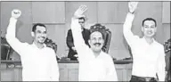  ??  ?? The leaders of Gafatar group (L-R) Mahful Muis Tumanurung, Ahmad Musadeq and Andry Cahya wave their hands during their trial at East Jakarta district court in Indonesia, March 7, 2017 in this photo taken by Antara Foto. Picture taken March 7, 2017....