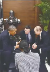  ?? — AP ?? ANTALYA, Turkey: US President Barack Obama (left) speaks with Russian President Vladimir Putin (right) prior to the opening session of the G20 summit yesterday.