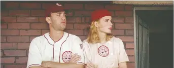  ?? COLUMBIA PICTURES ?? Tom Hanks, left, and Geena Davis star in the 1992 comedy A League of Their Own.