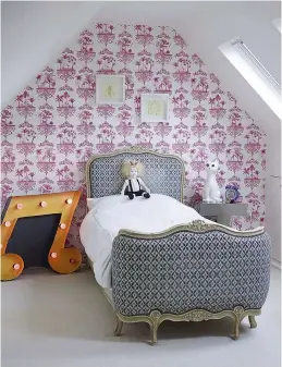  ??  ?? One wall in the master bedroom is papered with a design by Deborah Bowness, the bed is Vivaldi by Stuart Jones, and the bedside tables were from a junk shop in Hastings; the vintage note in Tippi-Rose’s bedroom (left) came from a fellow antiques...