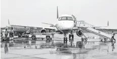  ?? SHARON MONTGOMERY-DUPE/CAPE BRETON POST ?? Passengers board an Air Canada airplane at the JA Douglas McCurdy Airport in Sydney in this file photo. Air Canada officials have confirmed they now have a ramp at the Sydney airport but don’t have an exact date yet of when it will be put in service.