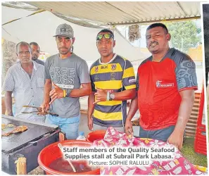  ?? Picture: SOPHIE RALULU ?? Staff members of the Quality Seafood Supplies stall at Subrail Park Labasa.