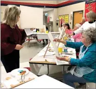  ?? COURTESY PHOTO ?? Retired art teacher Charlene Bergen leads a fall painting class as a fundraiser for MC4Kids in Noel. The $500 raised will help secure additional food staples for local families over the holiday season. Food donations are still be accepted at any local school.