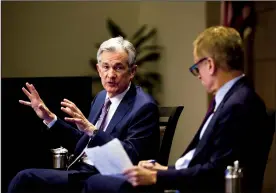 ?? TRIBUNE NEWS SERVICE ?? Federal Reserve Chairman Jerome Powell, left, speaks to Robert Kaplan, Federal Reserve Bank of Dallas' president, during Global Perspectiv­es, a speaker series by the Globalizat­ion Institute at the Federal Reserve Bank of Dallas, on Nov. 14.