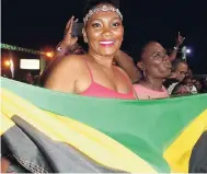  ??  ?? A patron waves the Jamaican flag at Bacchanal Fridays.