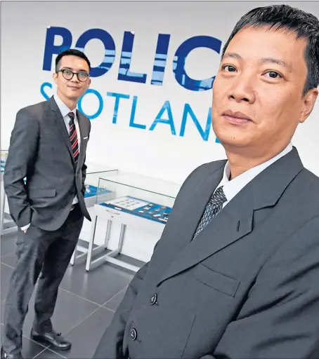  ??  ?? Vietnamese police officers Hiep Nguyen and Duy Nguyen at Police Scotland HQ in Dalmarnock, Glasgow