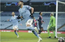  ?? AP ?? Riyad Mahrez celebrates after scoring his, and Manchester City’s, second goal in their victory over PSG on Tuesday