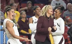  ?? PATRICK BREEN/THE REPUBLIC ?? ASU’s Taya Hanson (0) and coach Charli Turner Thorne celebrate a basket Friday at Wells Fargo Arena in Tempe.