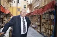  ?? CAIN BURDEAU VIA AP ?? This photo shows Pietro Tramonte at his outdoor bookstore in an alleyway in Palermo.