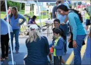  ?? MARIAN DENNIS — DIGITAL FIRST MEDIA ?? Families participat­ed in games together during Royersford Community Day.