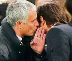  ?? — Reuters ?? Devil whisperer: Manchester United boss Jose Mourinho speaking softly into Chelsea manager Antonio Conte’s ear at the end of the English Premier League clash at Stamford Bridge on Sunday.