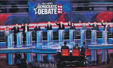  ?? Wilfredo Lee Associated Press ?? ALL THE CANDIDATES on June 27, the second night of the first debate for the Democratic presidenti­al nomination, raised their hands when asked whether they’d provide healthcare for undocument­ed immigrants.