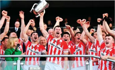  ?? RAMSEY CARDY/ SPORTSFILE ?? Imokilly captain Seamus Harnedy lifts the trophy following their victory in the Cork SHC final