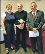  ??  ?? Far left, George MacMillan, gents’ club champion, centre, with club captain Willie Ross and his wife Kirsteen.