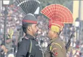  ?? AP FILE ?? Indian and Pakistani soldiers face off at Wagah border.