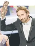  ??  ?? NEWCOMERS: French singer and actress Izia Higelin reacts as she holds her trophy after winning the Best Newcomer Actress award; and Belgian actor Matthias Schoenaert­s raises his trophy for Best Newcomer Actor.