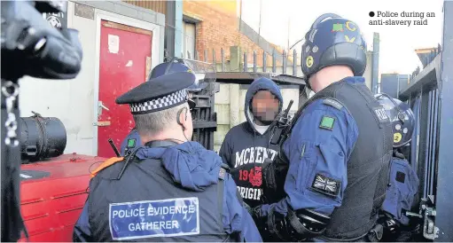  ??  ?? Police during an anti-slavery raid