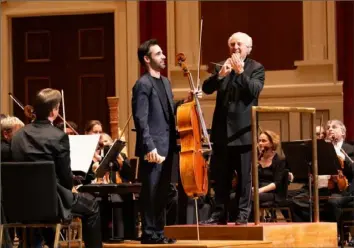  ?? Pittsburgh Symphony Orchestra ?? Cellist Pablo Ferrandez and music director Manfred Honeck after the Pittsburgh Symphony's performanc­e Friday of Shostakovi­ch's Concerto No. 1 for Cello and Orchestra at Heinz Hall.