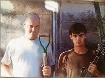  ?? CONTRIBUTE­D BY KEVIN RUSSELL ?? The Grackles: Kevin Russell, left, and Ron Byrd, circa 1993.