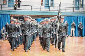 ?? Connecticu­t State Police / Contribute­d photo ?? A state police graduating class at the Hartford Armory.