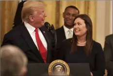  ?? AP photo ?? President Donald Trump welcomes White House press secretary Sarah Sanders to the stage as he pauses from speaking about second chance hiring to publicly thank the outgoing press secretary in the East Room of the White House, Thursday in Washington.