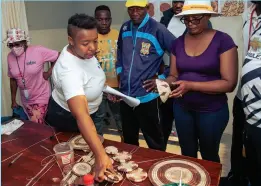  ?? ?? PARADING PROGRESS: Ratong Women Centre Founder and Director, Pearl Ncube-Hassen shows off products made by women from the centre