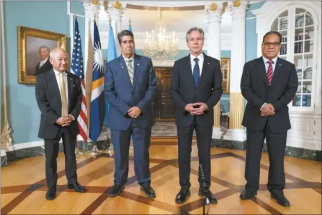  ?? AP file photo ?? Secretary of State Antony Blinken (at center right), meets with, from left, Marshall Islands Foreign Affairs and Trade Minister Jack Ading, Palau’s President Surangel Whipps, Jr., Blinken, and Micronesia’s President Wesley Simina on Sept. 26, at the State Department in Washington. U.S. officials stressed Tuesday, that newly-approved legislatio­n providing billions of dollars in funding for three strategica­lly-important Pacific island nations is an important sign of American commitment, which comes amid warnings China is actively trying to pry them away from Washington’s sphere of influence.