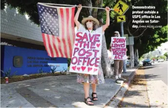  ?? CHRIS PIZZELLO/AP ?? Demonstrat­ors protest outside a USPS office in Los Angeles on Saturday.