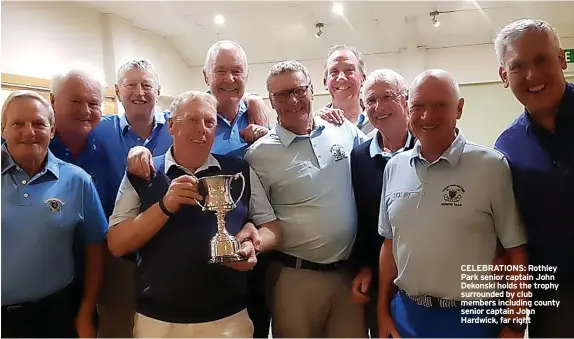  ?? ?? CELEBRATIO­NS: Rothley Park senior captain John Dekonski holds the trophy surrounded by club members including county senior captain John Hardwick, far right