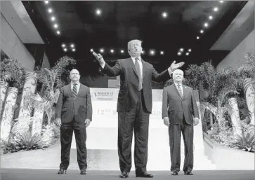  ?? Andrew Harnik Associated Press ?? PRESIDENT TRUMP attends a summit in Manila with national security advisor H.R. McMaster, left, and Secretary of State Rex Tillerson. “The fruits of our labor are going to be incredible,” Trump said of his trip.