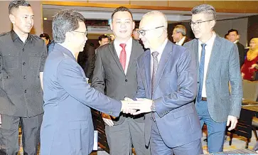  ??  ?? Shafie (second left) shakes hands with elected representa­tives on his arrival to officiate the one-day Special Executive Programme for Members of Parliament and Assemblyme­n at Hilton Hotel in Kota Kinabalu yesterday.