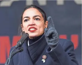  ?? ANGELA WEISS/AFP/GETTY IMAGES ?? Rep. Alexandria Ocasio-Cortez, D-N.Y., equated younger generation­s’ fight to stop climate change with World War II.