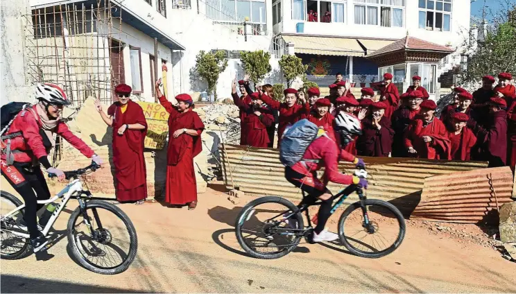  ?? Photos: AFP ?? The nuns traded their maroon robes for cycling gear and helmets as they embarked on a cycling trip to promote gender equality. —