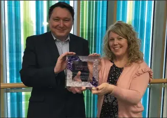  ??  ?? Gerard Gahagan, head of Epilepsy Services, and nurse manager Lorraine Jackson with the award