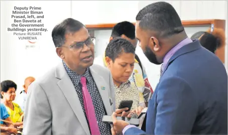  ?? Picture: RUSIATE VUNIREWA ?? Deputy Prime Minister Biman Prasad, left, and Ben Daveta at the Government Buildings yesterday.
