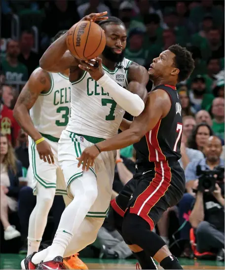  ?? STUART CAHILL / HERALD STAFF ?? SLOPPY START: Jaylen Brown loses control of the ball to Miami’s Kyle Lowry in the Celtics’ 109-103 loss to the Heat in Game 3 of the Eastern Conference Finals at TD Garden on Saturday night.