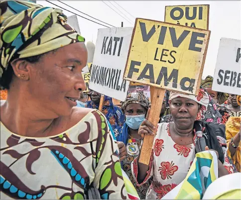  ?? ?? A military widows group protests in Bamako, Mali, in support of co-operation between Malian and Russian forces