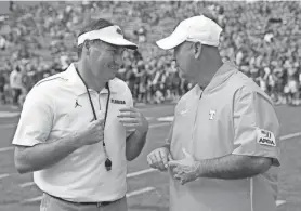  ?? JOHN RAOUX/AP ?? Florida head coach Dan Mullen, left, and Tennessee head coach Jeremy Pruitt greet each other before a game in 2019.