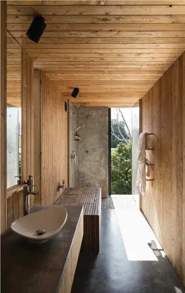 ??  ?? Bathware from Franklin: Basin ‘Vitra Piu Due Pearl’. Bath ‘Bette Form’ by Cav & Redit with removable lid. Floor Peter Fell densifier on black oxide concrete slab. Shower duckboard on stainless steel rails. Lighting Brightgree­n from ECC. Lining Shiplap...