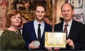  ?? Photo by Don MacMonagle ?? Shane O’Leary, Cordal, Castleisla­nd, County Kerry who was Overall Cheese Winner for his Cordal Goats Cheese, Cordal Garlic and Thyme receviing his award from Tom Mulvihill, Ornua and Mary Coleman, Listowel Food Fair.