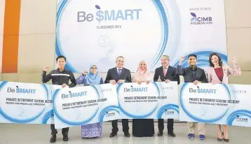  ??  ?? Cimb Foundation chairman Tan Sri Md Nor Yusof (third right), CIMB Group chairman Dato’ Sri Nazir Razak (third left), Hamidah (right) together with winners of the Be$MART programme, a newly launched financial literacy programme targeted at youths.